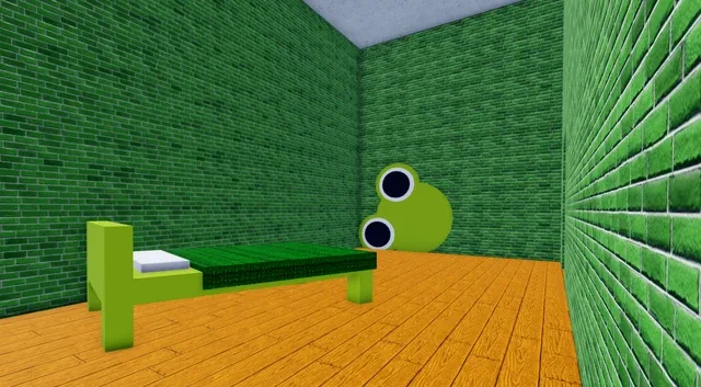 The bed, at the back of the room.
